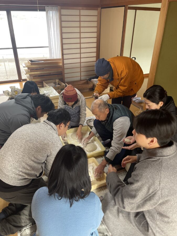 Students making mochi with locals