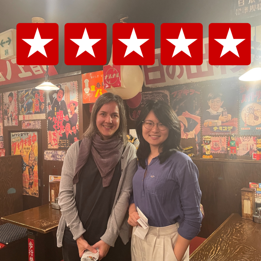 Silvia and the founder of Local Life Japan standing together in a Showa-themed restaurant, showcasing a cultural experience during her study program.